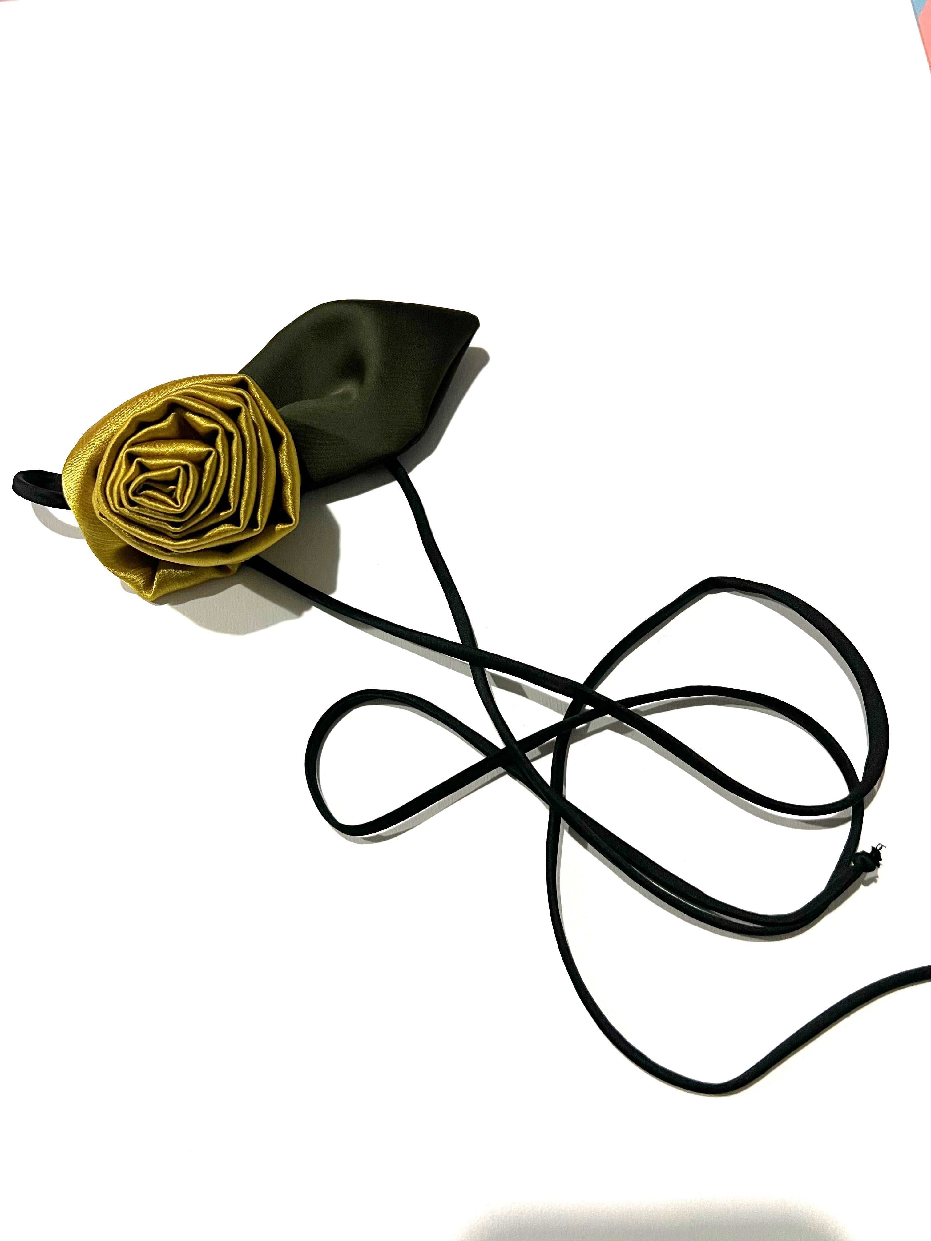 Close-up side view of the silk hair elastic adorned with roses, showcasing the intricate design and luxurious texture