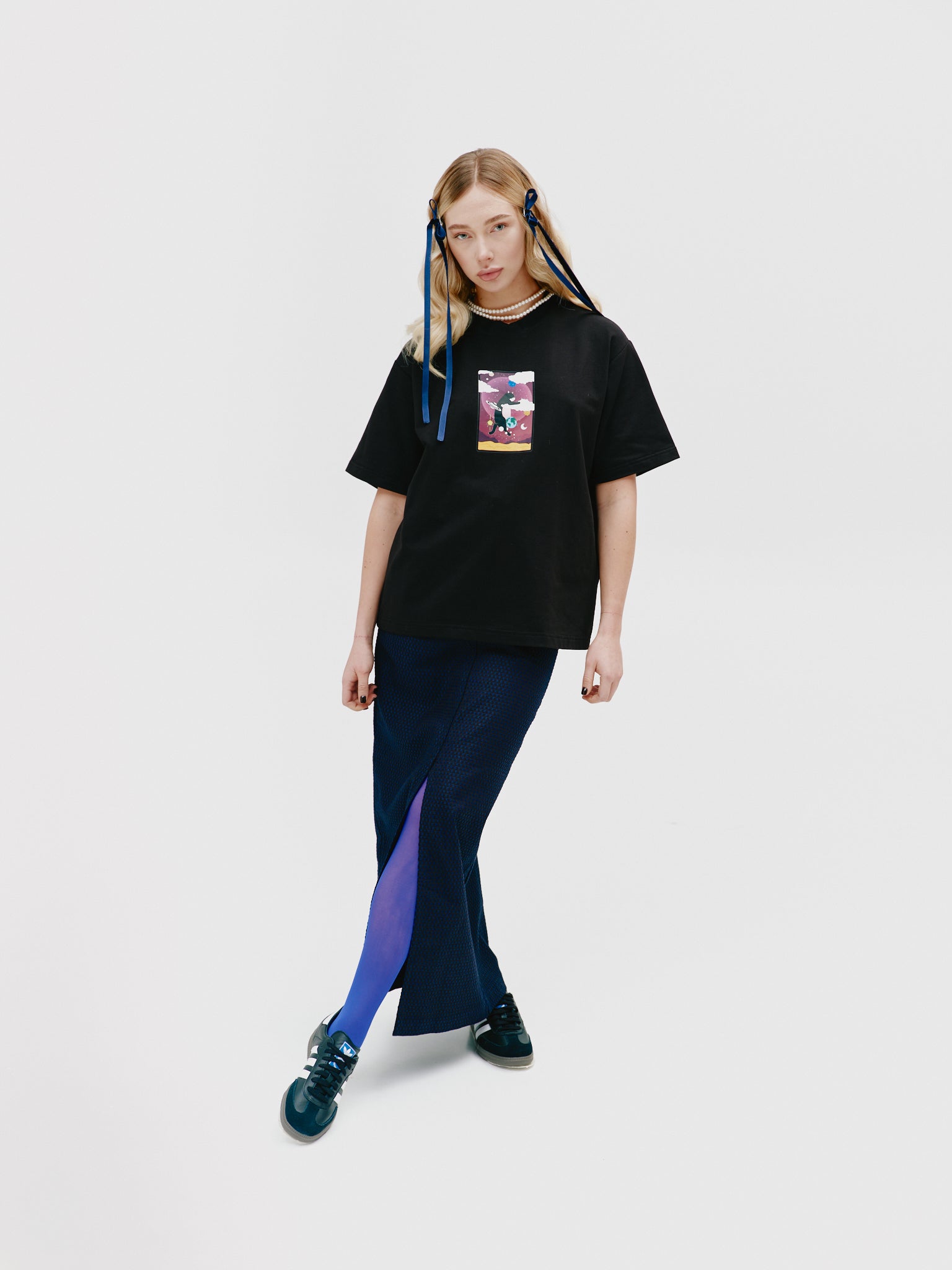 Side view of a unisex cotton t-shirt with a unique Tarot card print, inspired by celestial themes from 'The Moon' collection, offering both fashion-forward appeal and a touch of mysticism