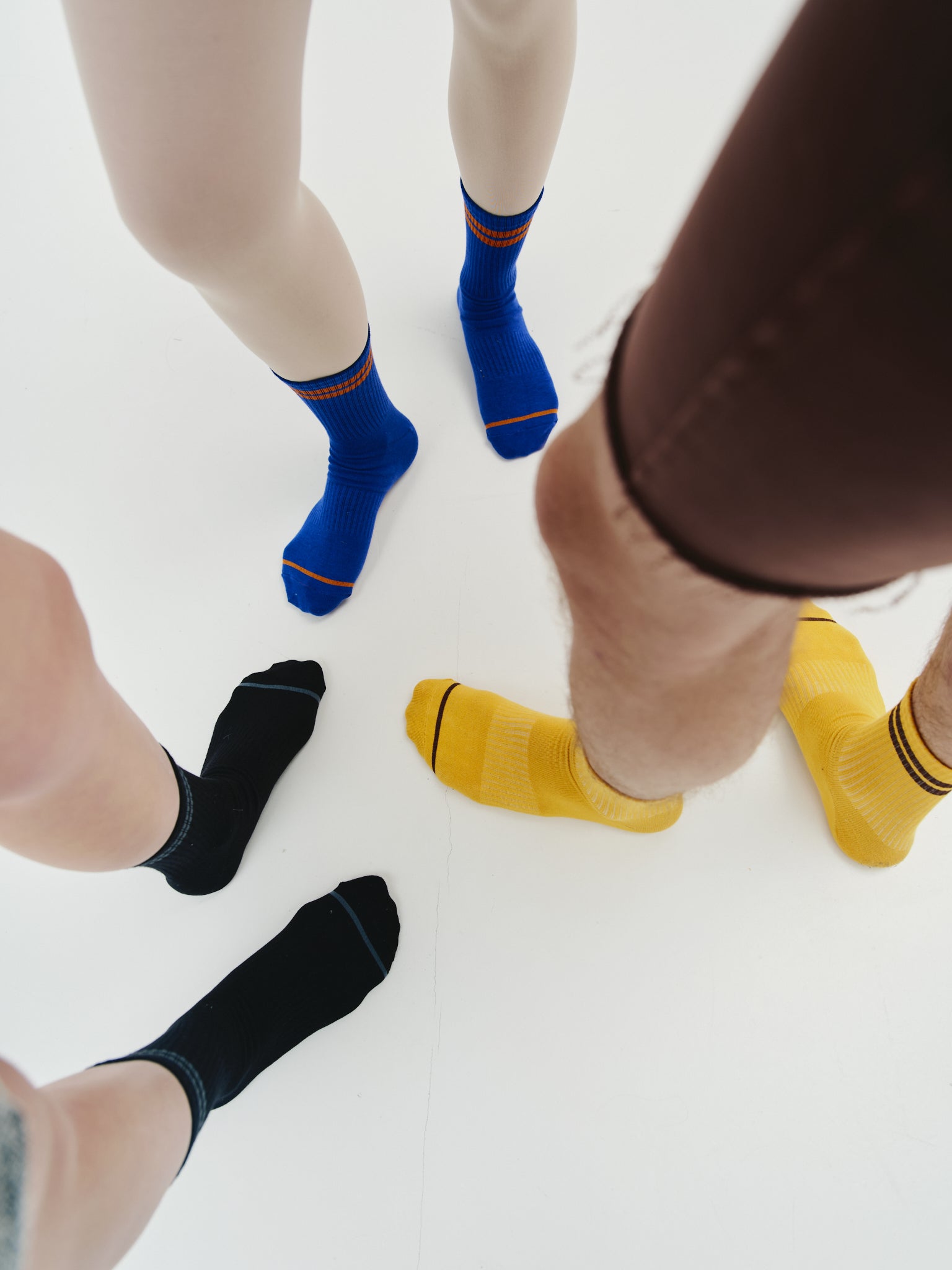 Close-up of the cotton socks featuring a branded logo on the sole, adding an exclusive touch to the design