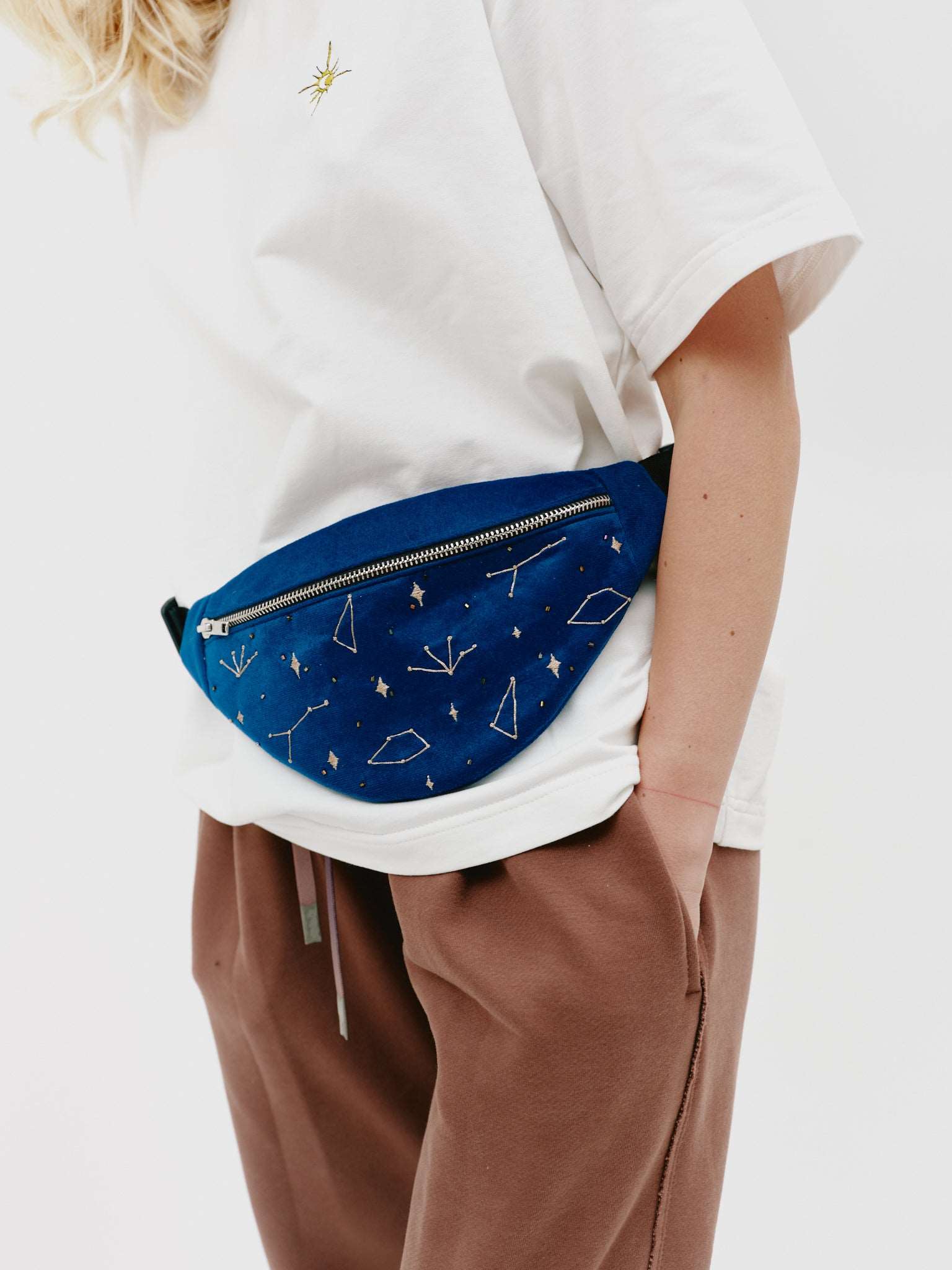 Close-up view of the back of the velvet waist bag, emphasizing the high-quality craftsmanship and smooth velvet fabric
