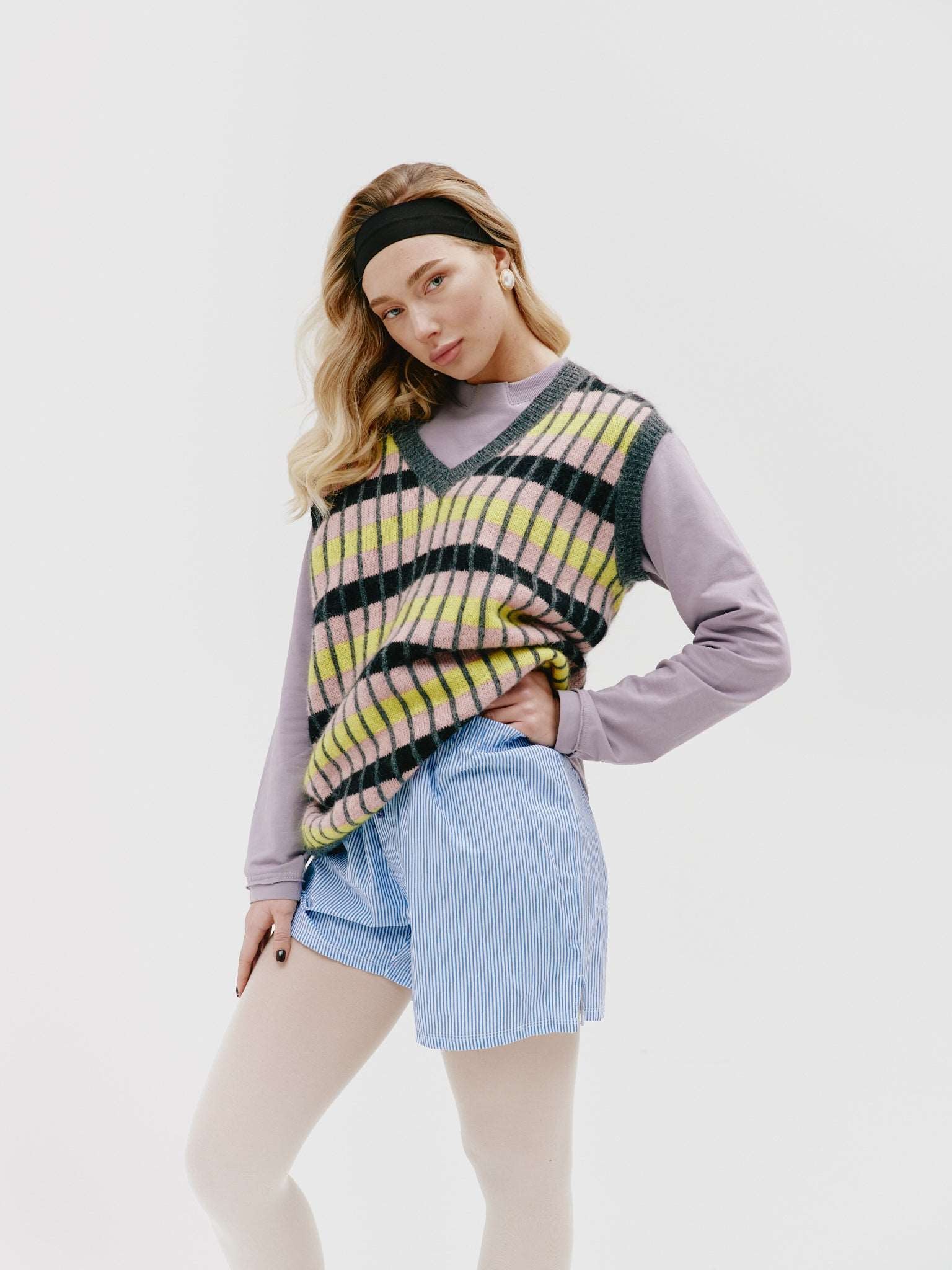 Close-up of the model wearing the vest, emphasizing the softness of the kid mohair fabric