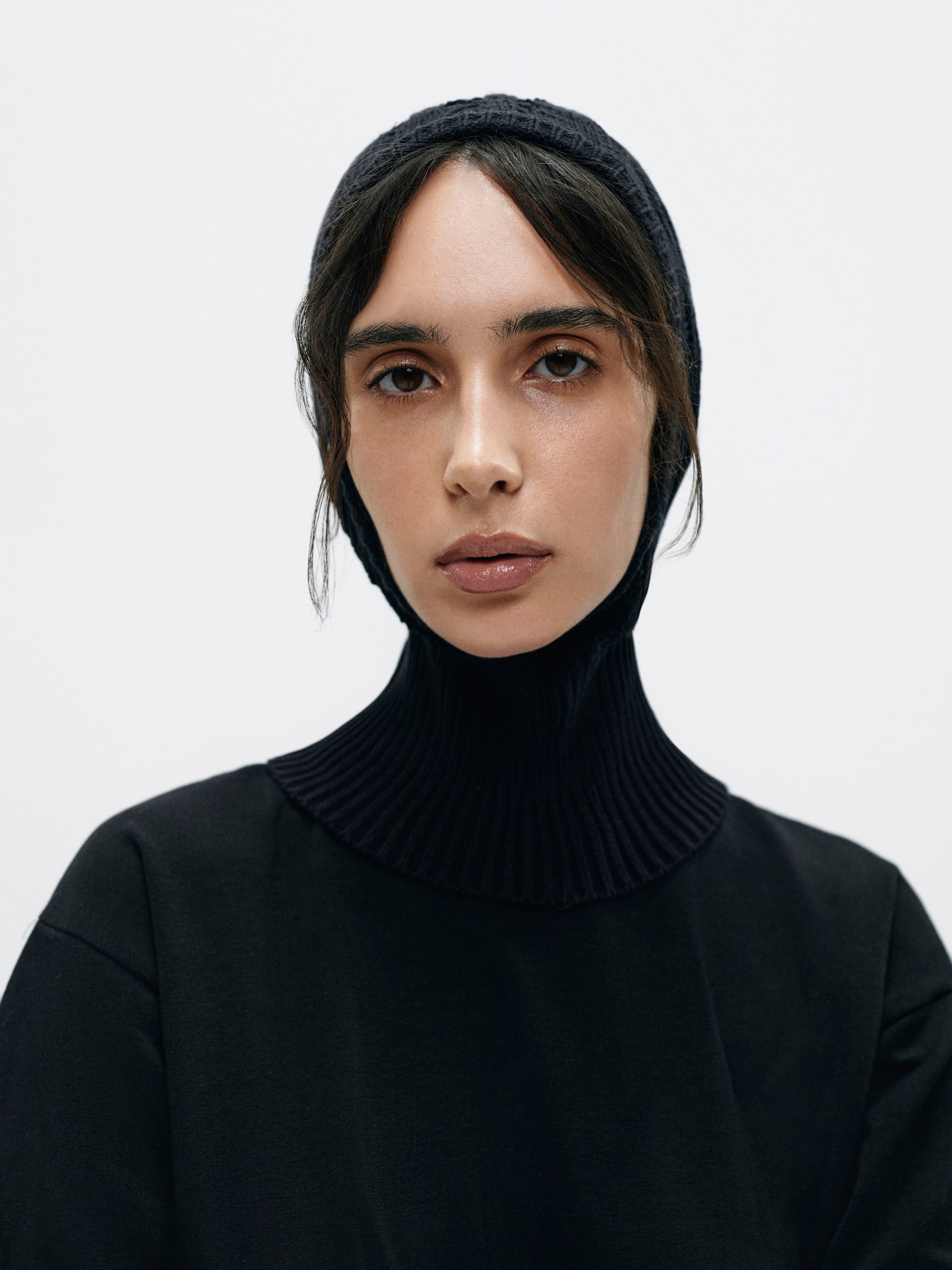 Close-up of the balaclava's textured cotton and acrylic blend, emphasizing the intricate knit technique