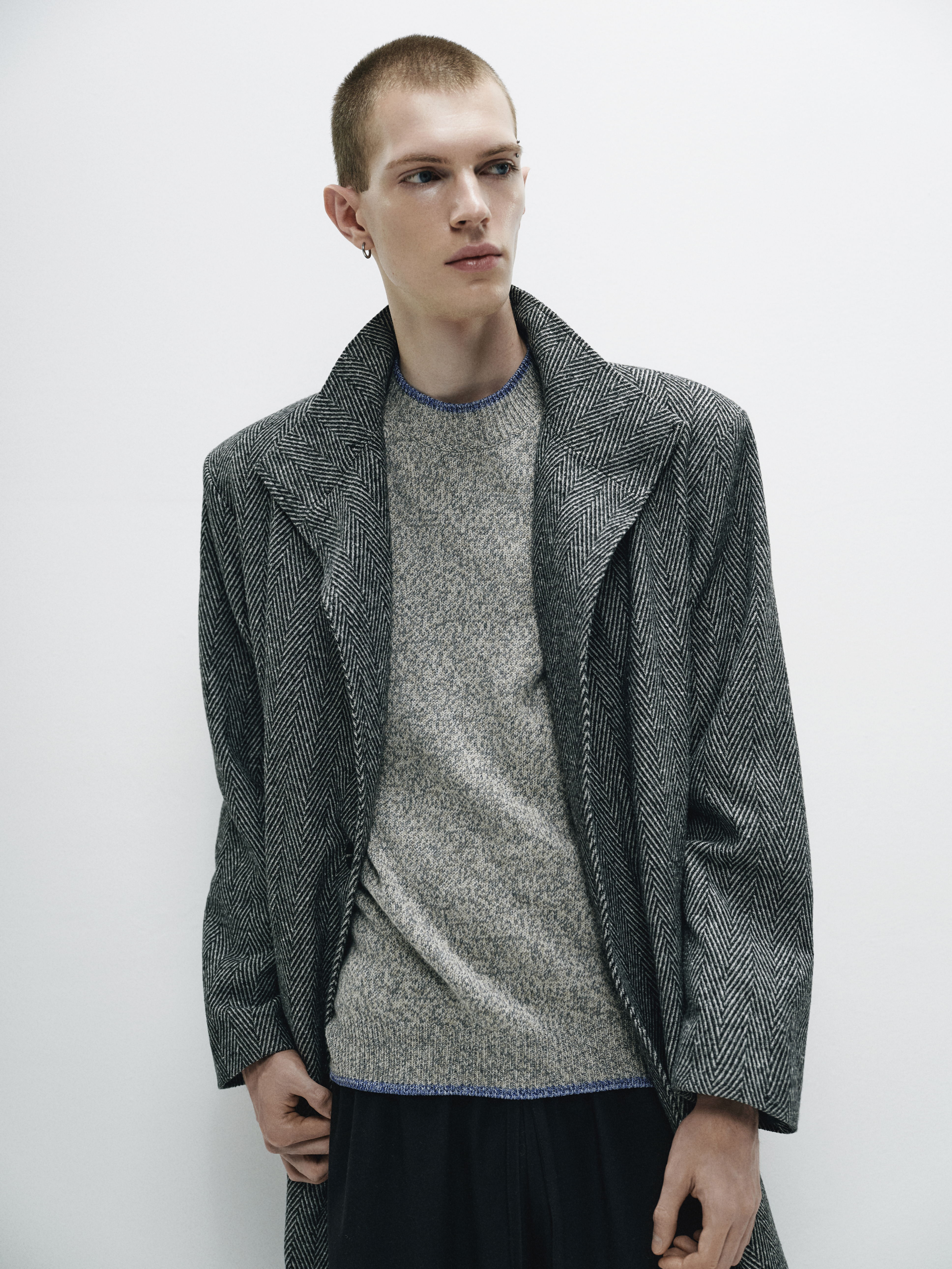 Close-up of the coat's textured fabric, illustrating its substantial yet refined composition