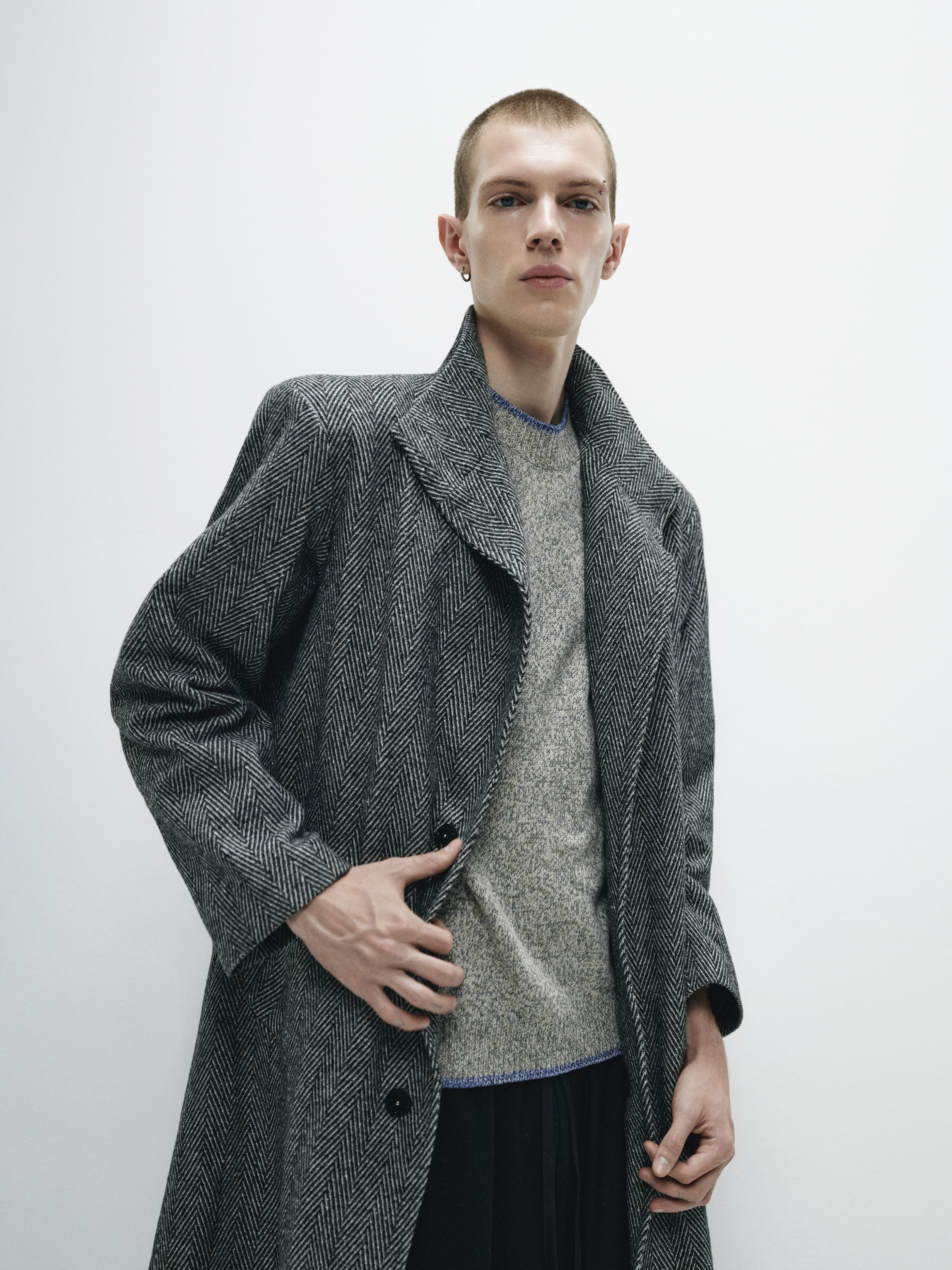 Close-up of the coat's textured fabric, illustrating its substantial yet refined composition