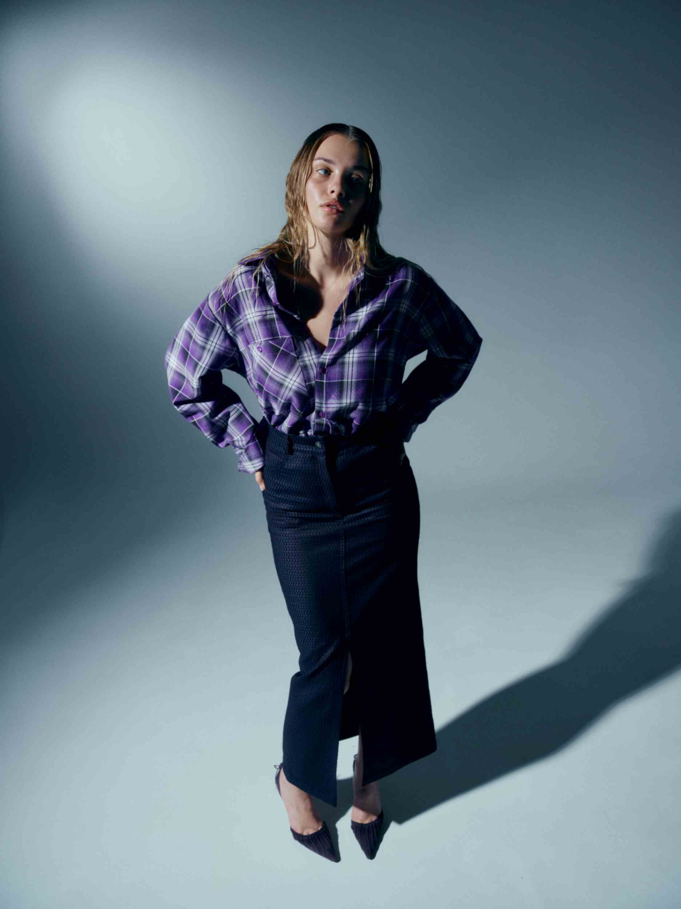 Side view of the pencil skirt, emphasizing its flattering fit and refined tailoring