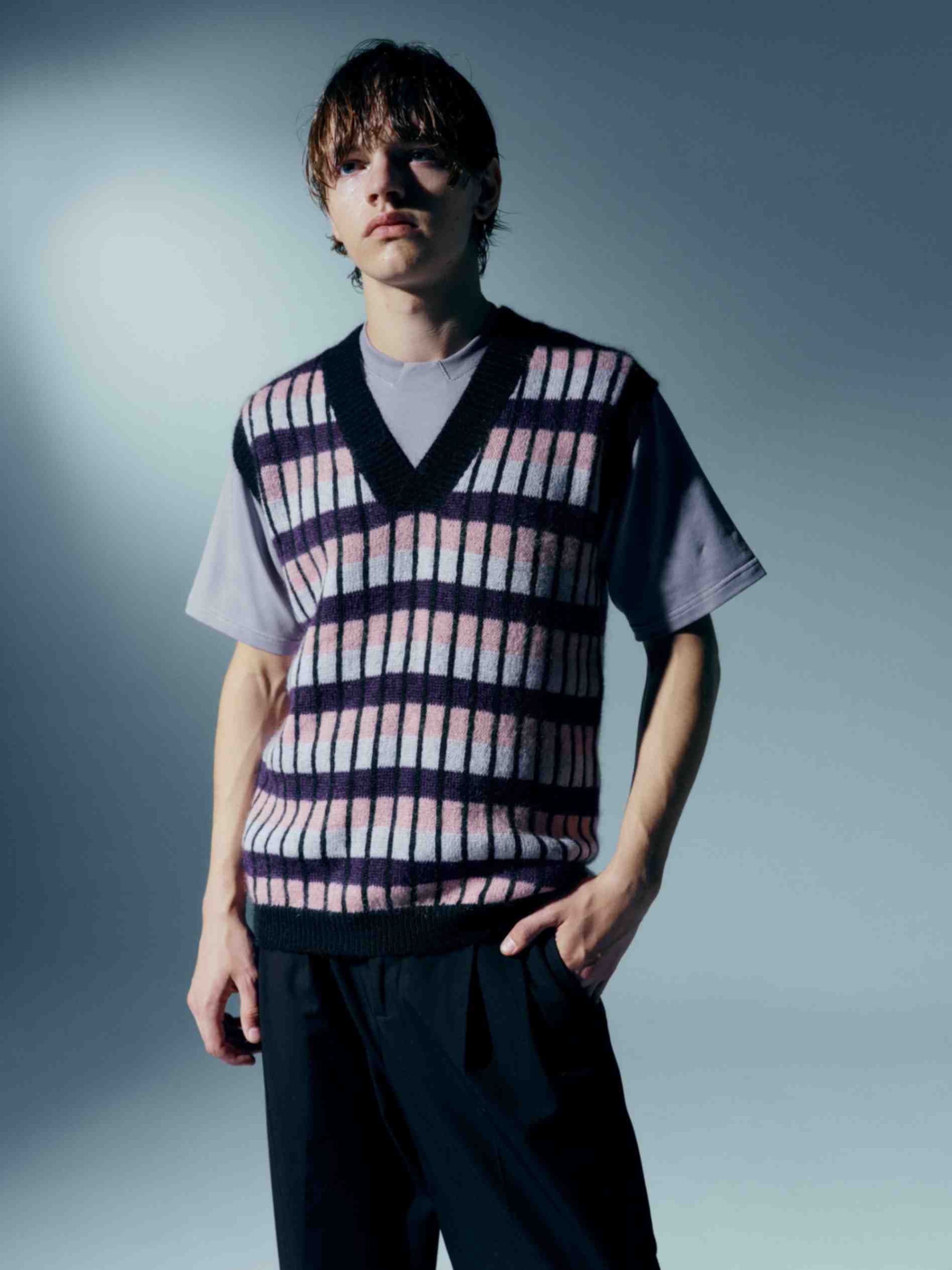 Close-up of the model wearing the vest, emphasizing the softness of the kid mohair fabric