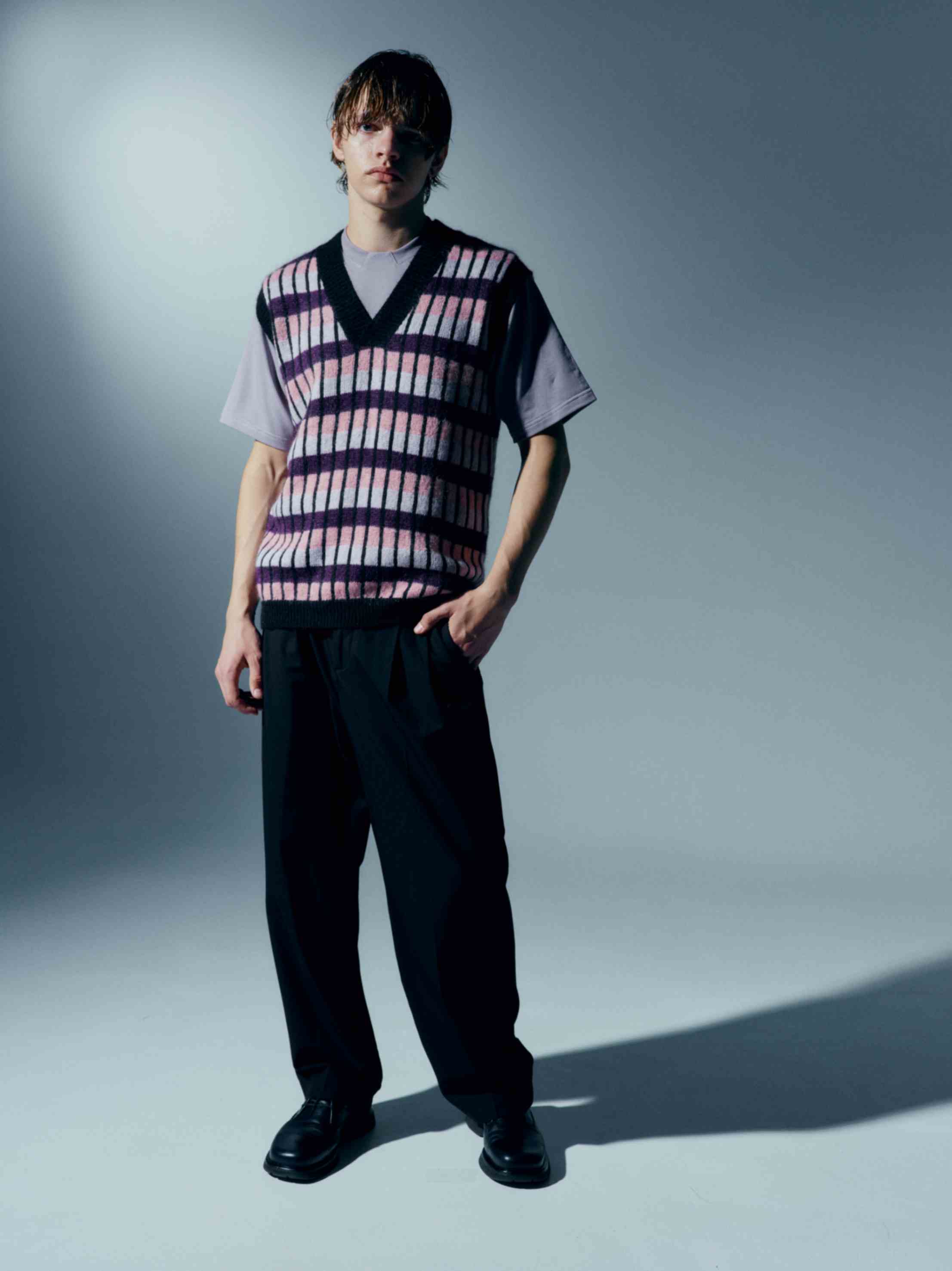 Model wearing the kid mohair vest with jeans, demonstrating how it pairs effortlessly with casual outfits