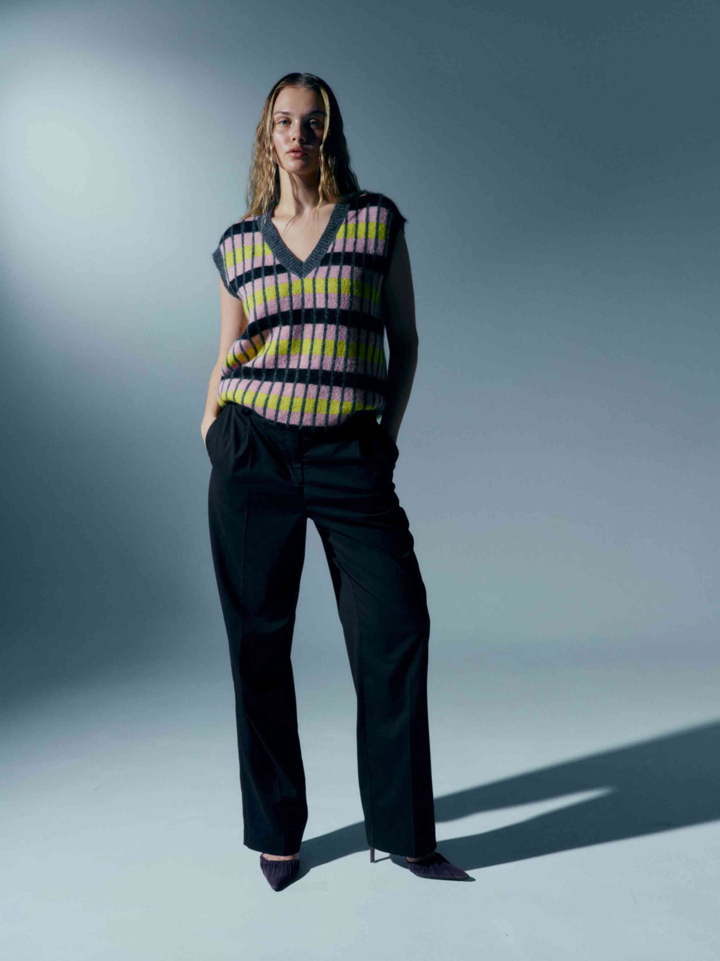 Model wearing the kid mohair vest with jeans, demonstrating how it pairs effortlessly with casual outfits